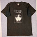 Black Supreme t-shirt with a graphic design on a gray background