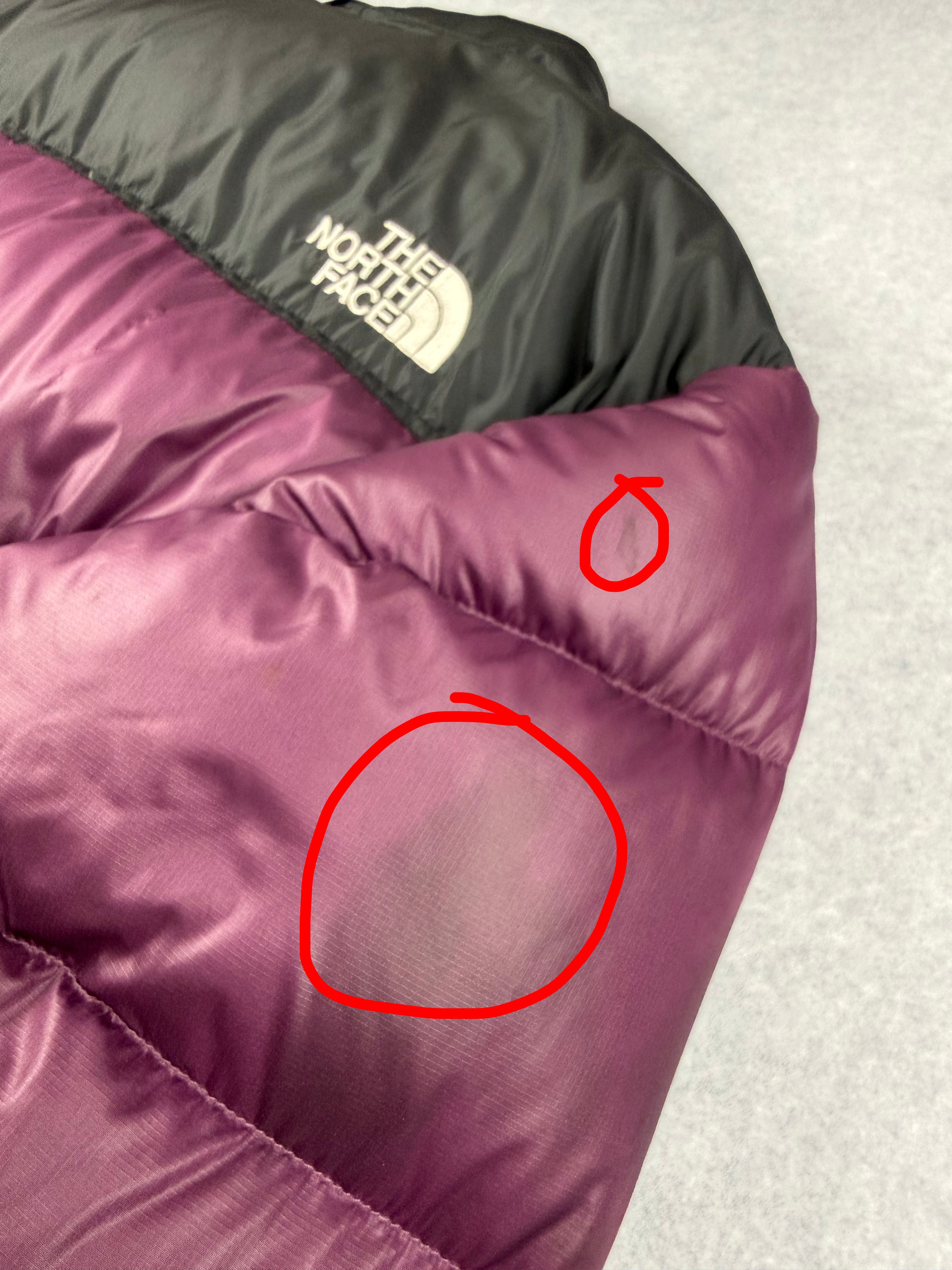 Purple Nuptse jacket with The North Face logo on a light gray background